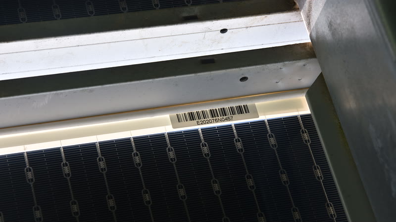 Close-up of a solar module barcode label used to build a georeferenced asset registry